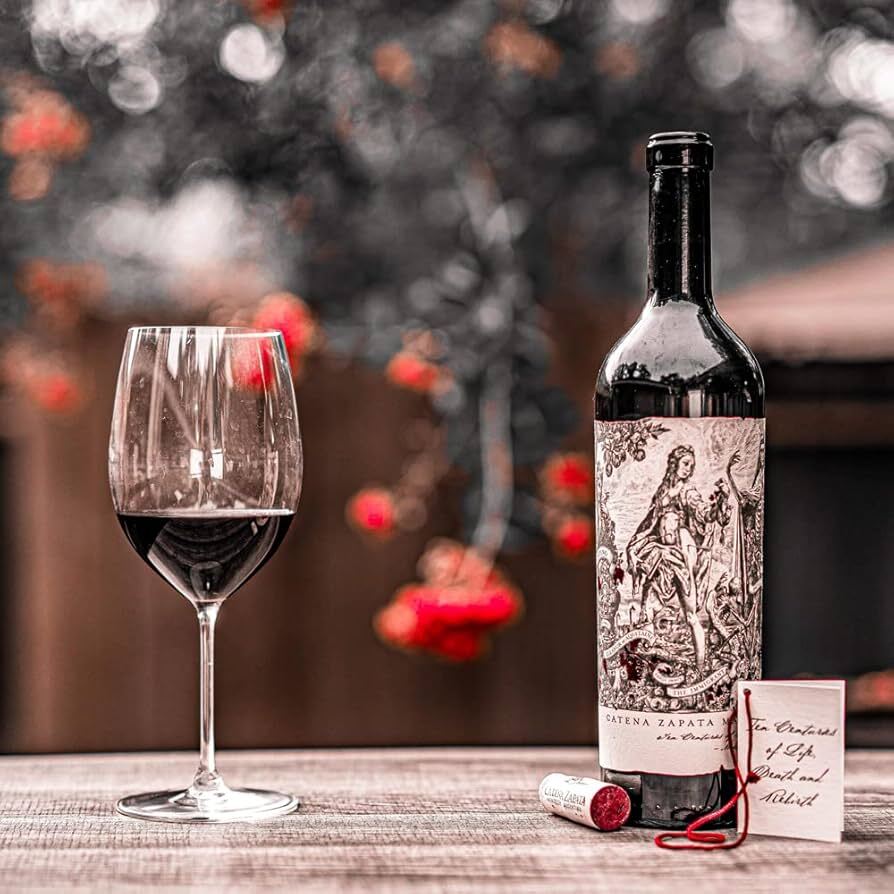 Bottle of Catena Zapata Malbec Argentino with wine glass and note card